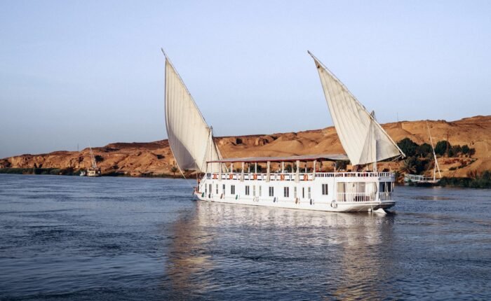 A traditional Dahabiya sailing boat on the Nile during a Dahabiya Nile cruise from Luxor.